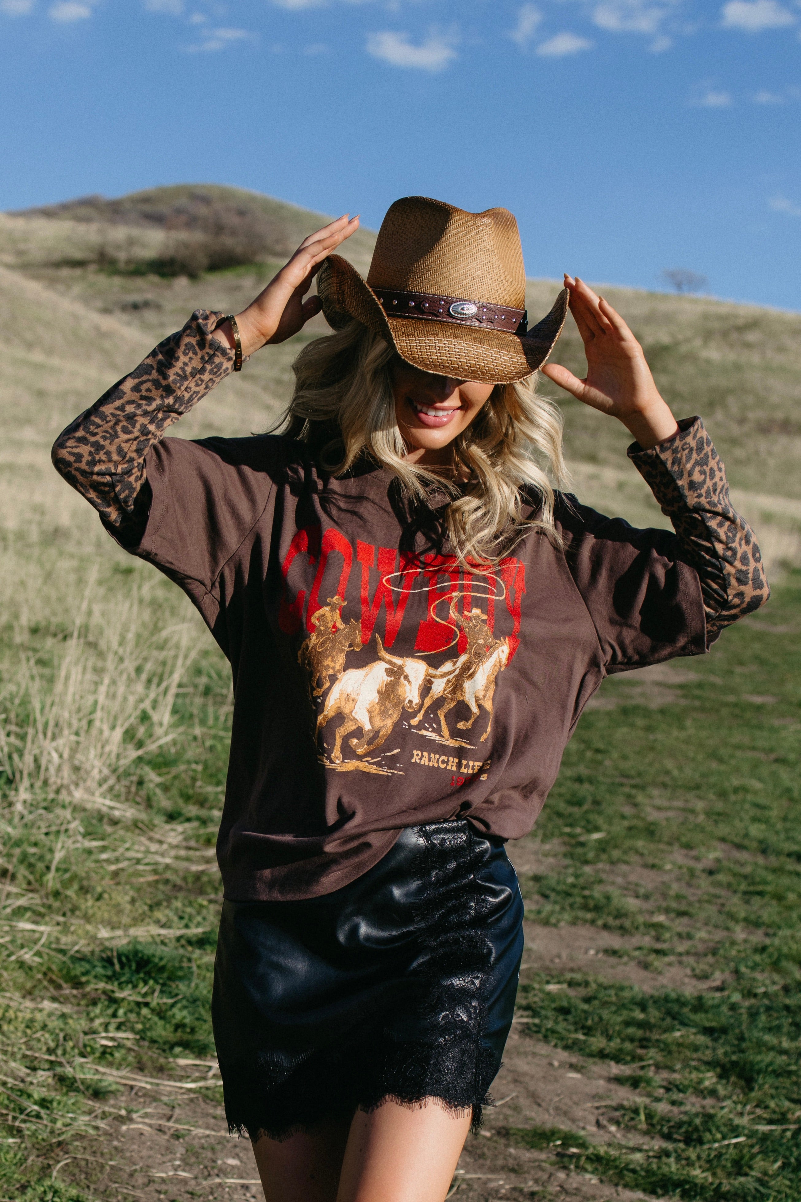 Straw style western cowboy hat with decorative band available in three colors