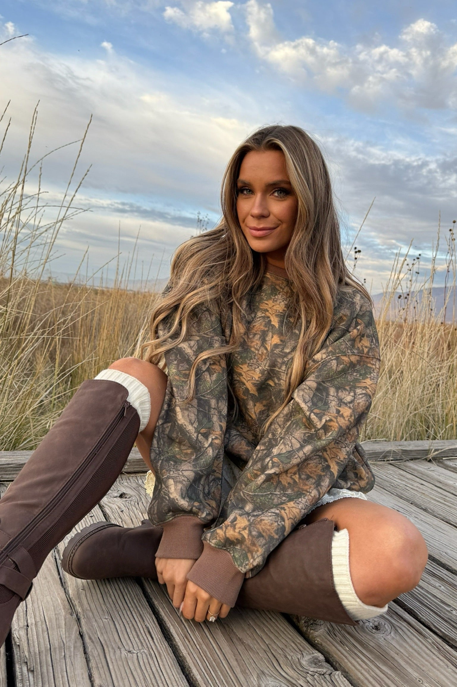camo long sleeve sweatshirt that matches with the same print sweatpants