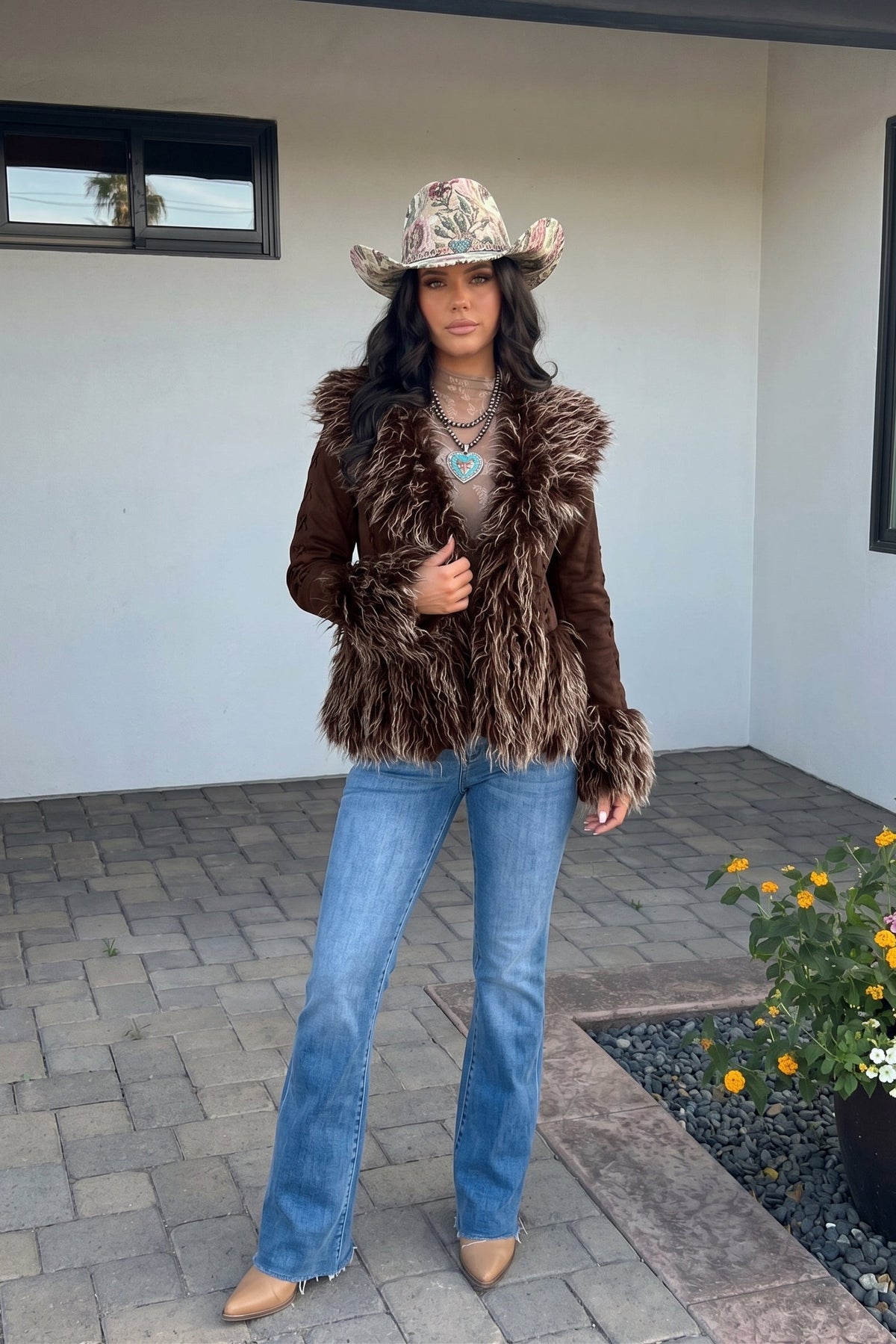 Suede and faux fur sleeve and collar trimmed jacket. Perfect for NFR and events you want to turns heads at.