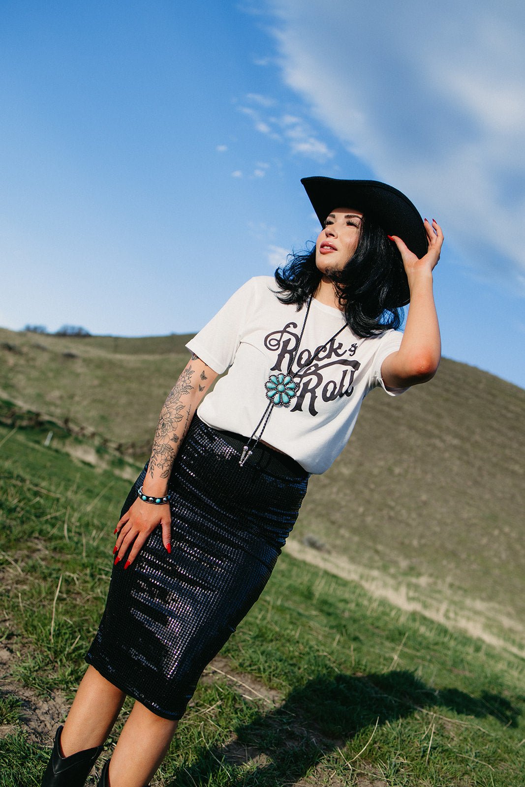 Black western midi skirt styled for gothic cowgirl outfits, country concert fashion, edgy western looks and festival cowgirl style from Sand + Charcoal Boutique