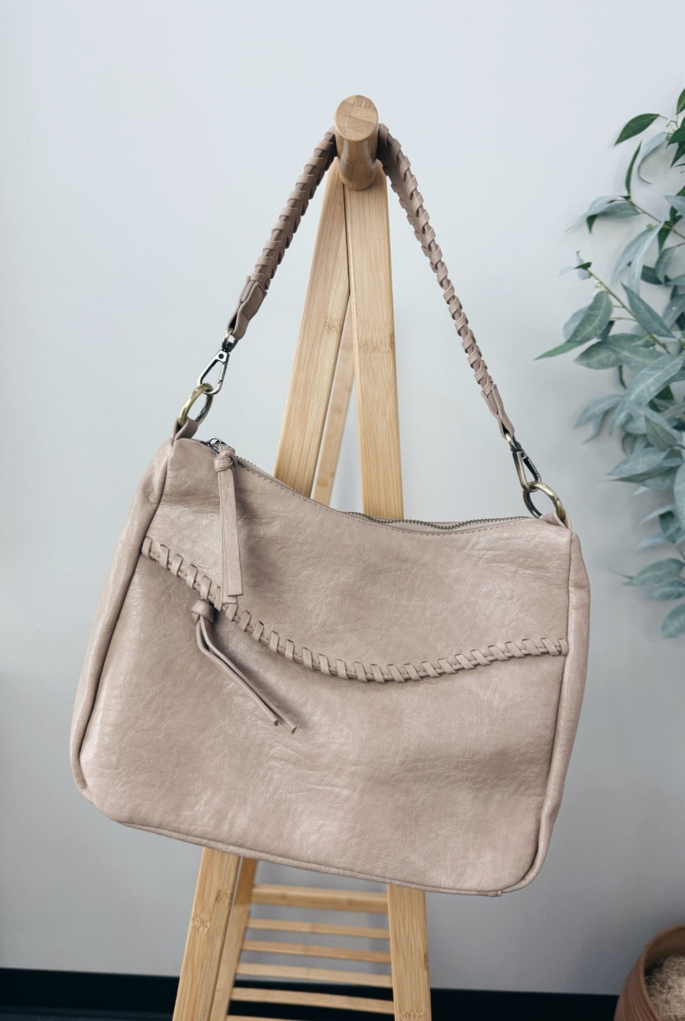 faux leather crossbody bay with braided detailing