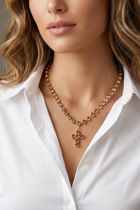 Gold-dipped champagne crystal rhinestone necklace with sparkling cross pendant and faceted glass crystals.