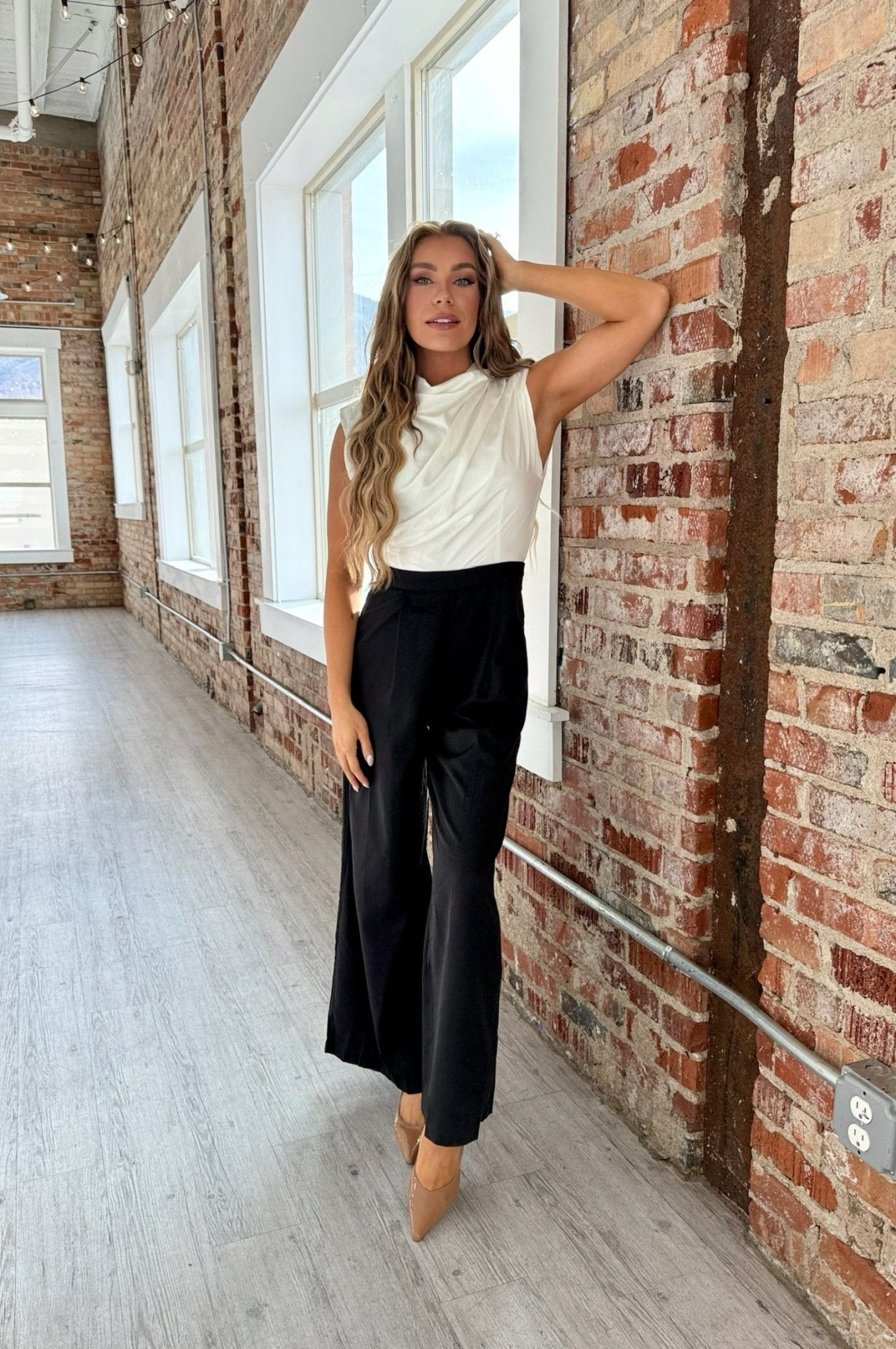 Sleeveless jumpsuit with draped neckline and keyhole back