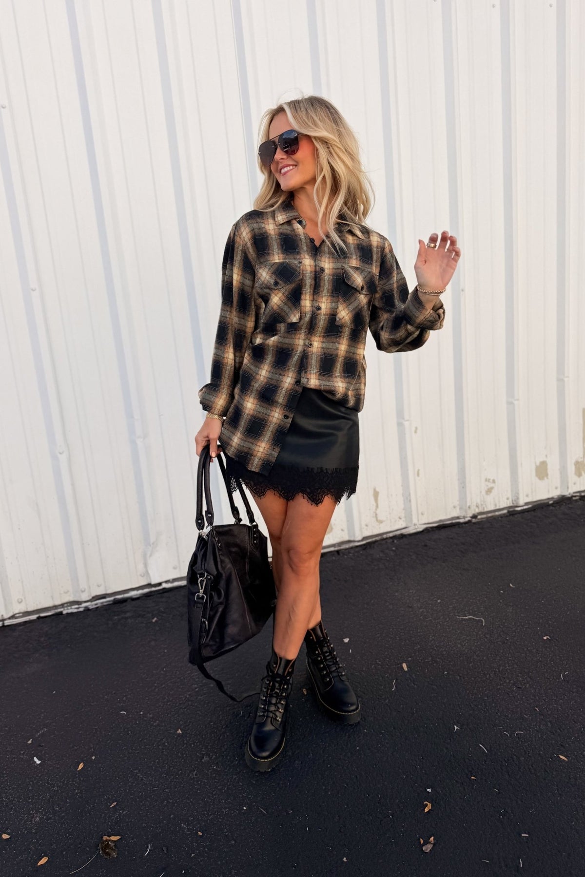 Women’s red, black and cream plaid flannel button-down shirt featuring a relaxed oversized fit, collared neckline, long sleeves, button front closure and dual chest flap pockets. Classic tartan plaid shirt styled as an easy layering piece for casual, grunge-inspired and fall outfits.