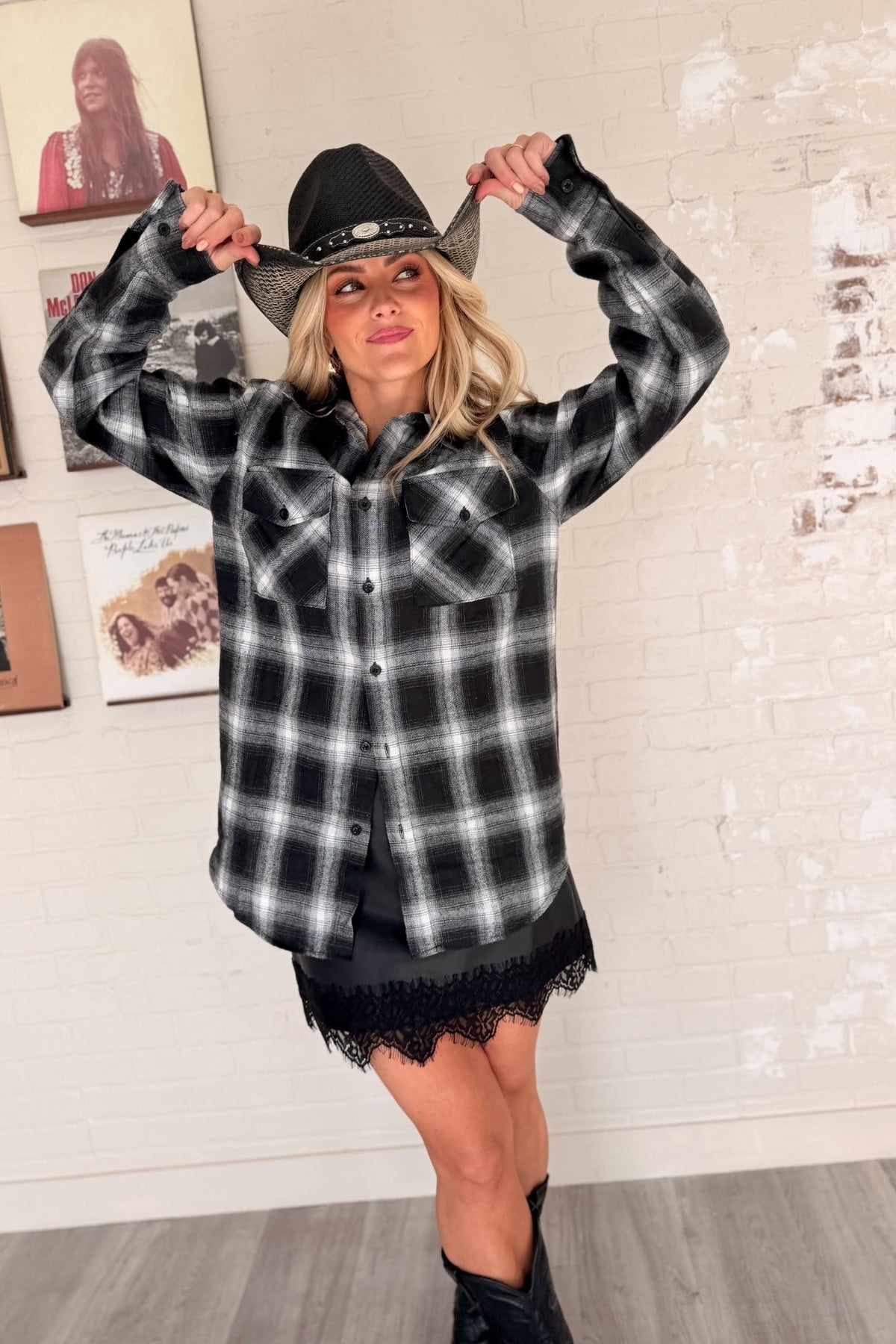 Women’s red, black and cream plaid flannel button-down shirt featuring a relaxed oversized fit, collared neckline, long sleeves, button front closure and dual chest flap pockets. Classic tartan plaid shirt styled as an easy layering piece for casual, grunge-inspired and fall outfits.