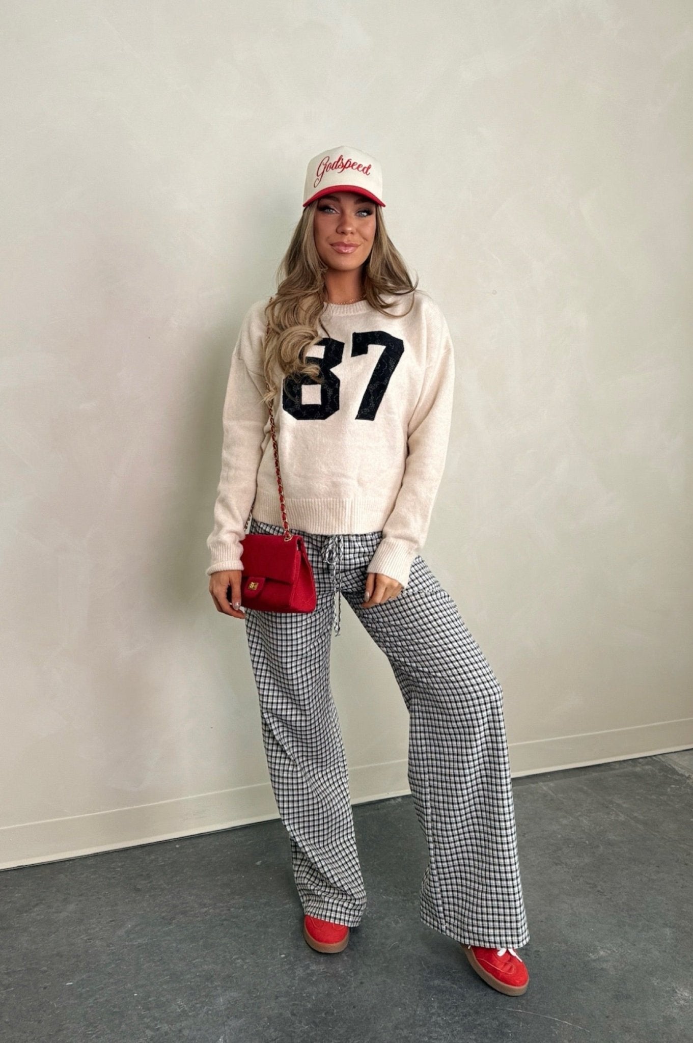 long sleeve sweater with bold number 87 on the front