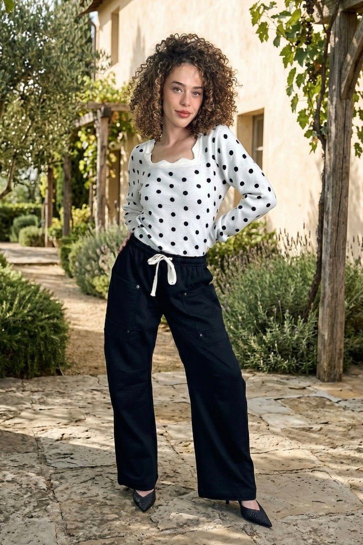 cargo sweatpants, wide leg joggers, utility pants women, black cargo pants, travel clothes for women, athleisure style, relaxed fit trousers, drawstring sweatpants, off-duty fashion