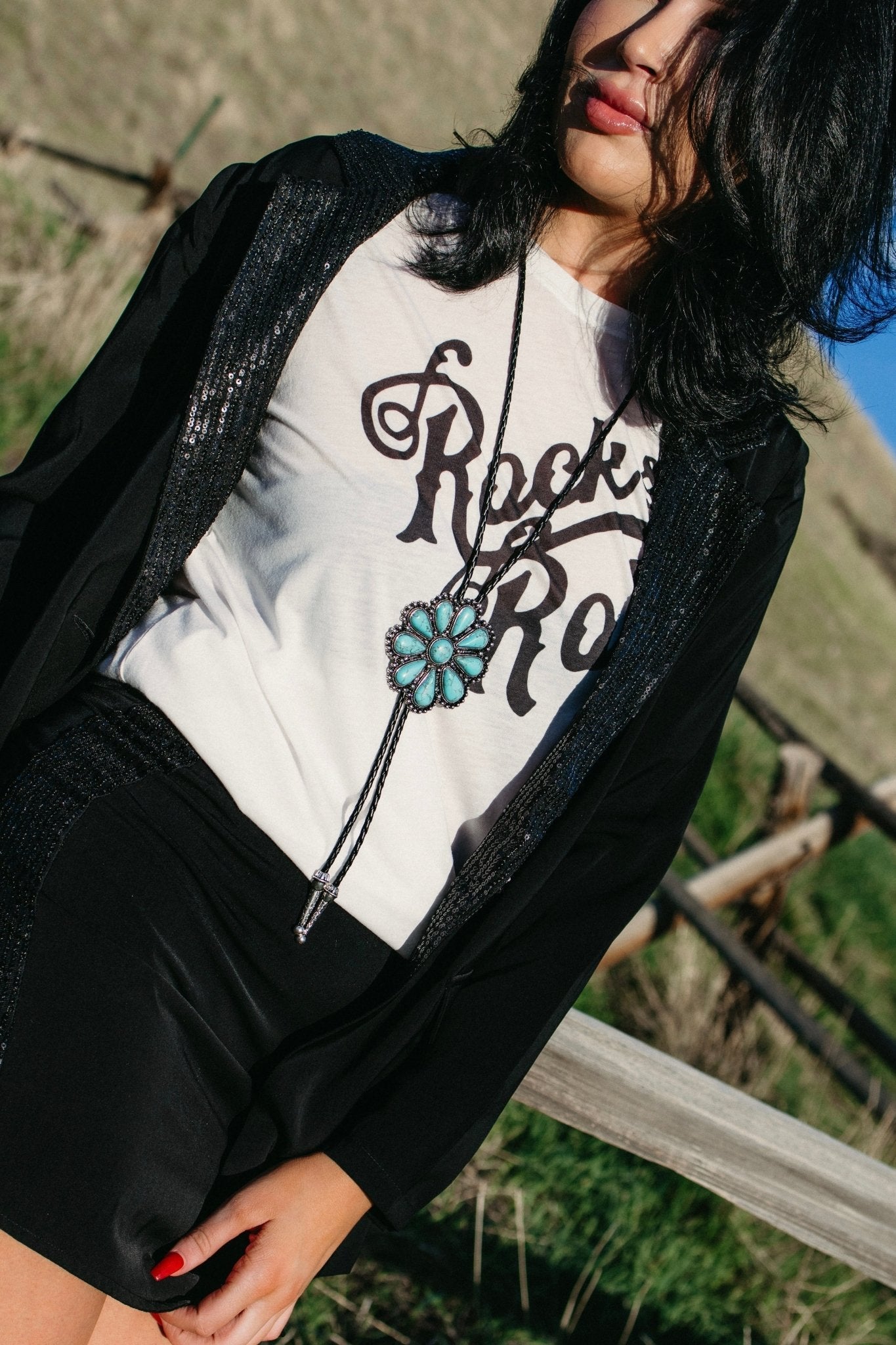 Turquoise western bolo necklace with floral concho detailing for country concert outfits, rodeo fashion, gothic cowgirl style, western festival looks, boho cowgirl jewelry, and edgy western boutique accessories from Sand + Charcoal Boutique.