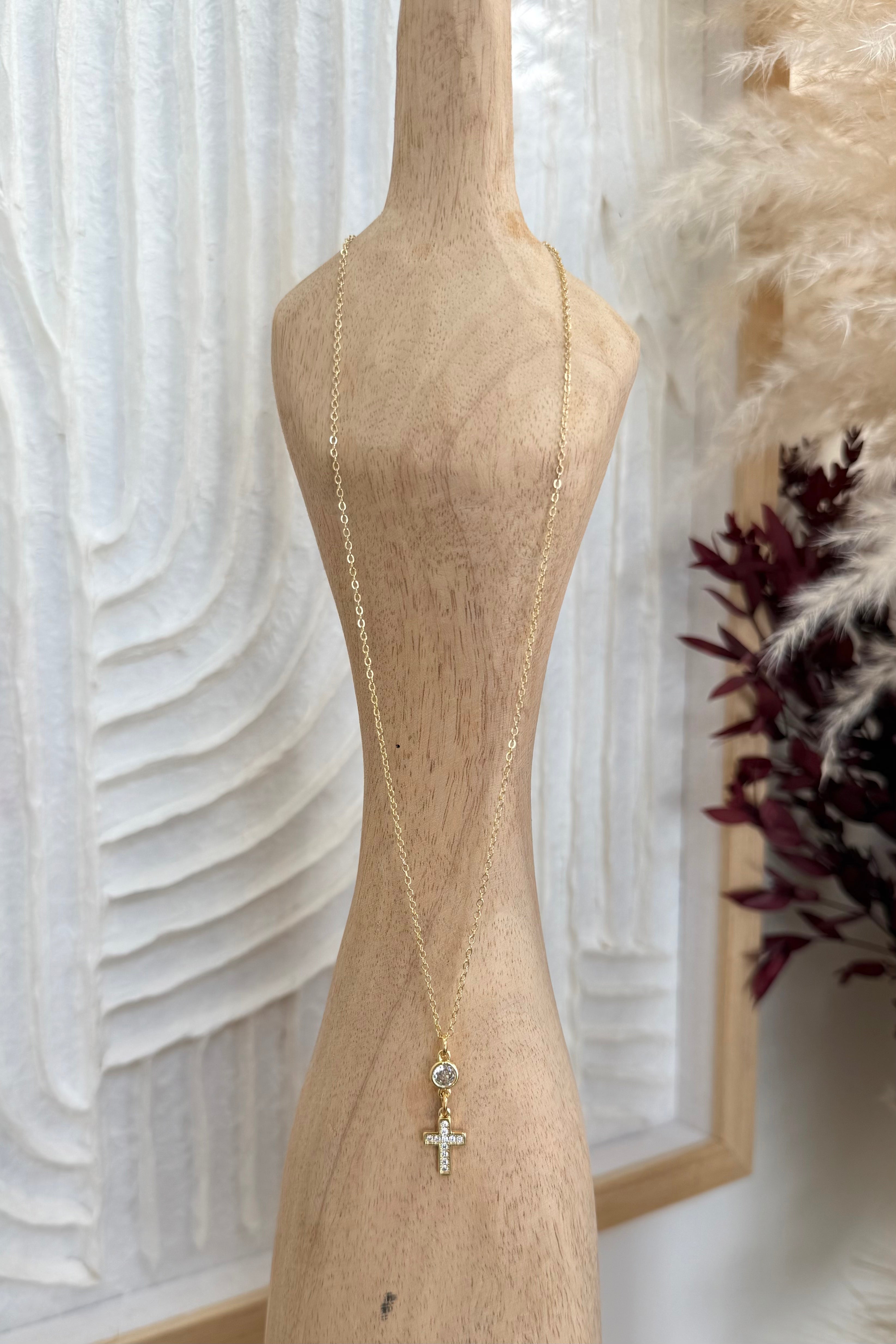 Gold cross pendant necklace with crystal accents