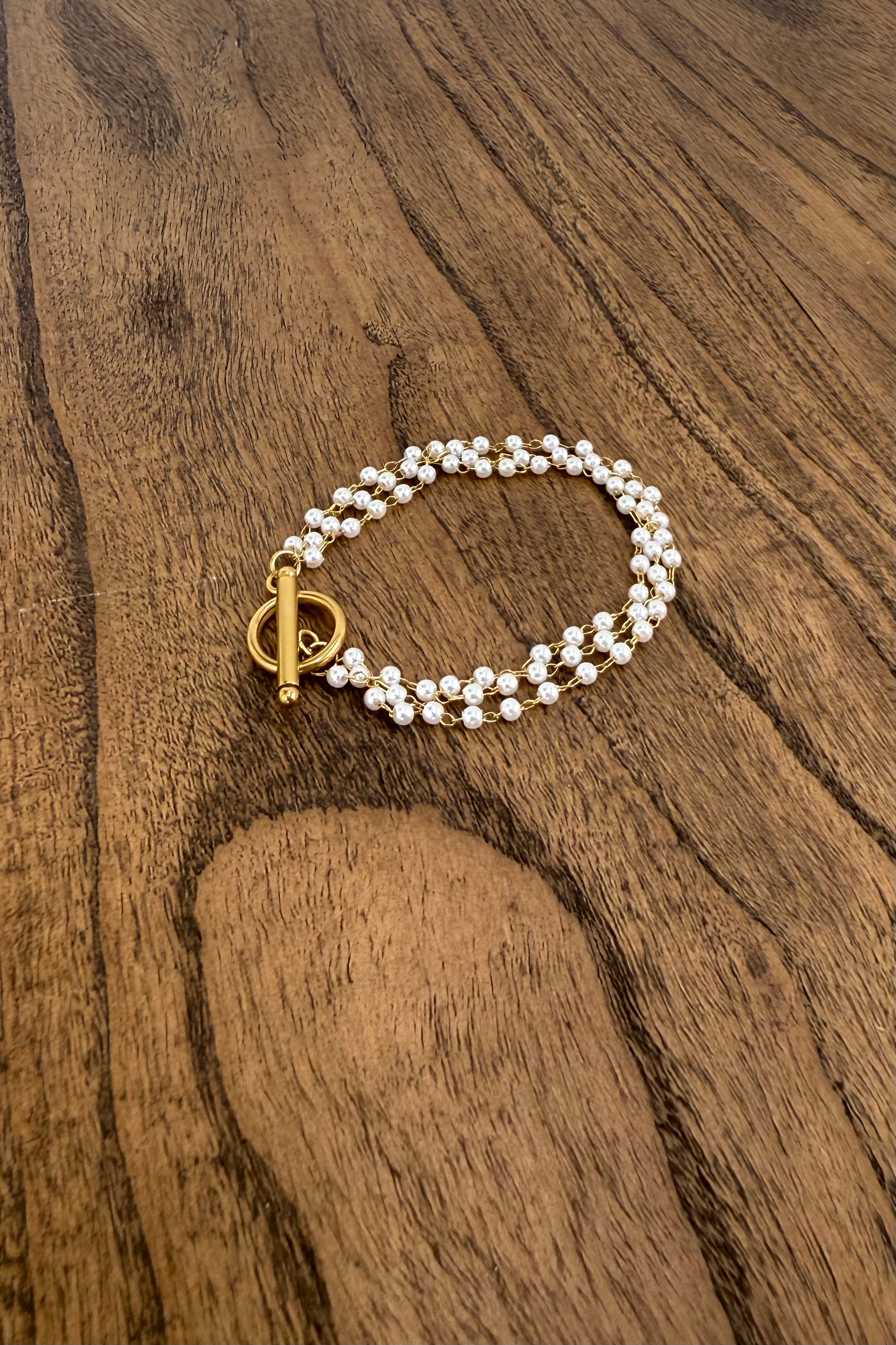 elegant multi layer pearl bracelet with toggle closure