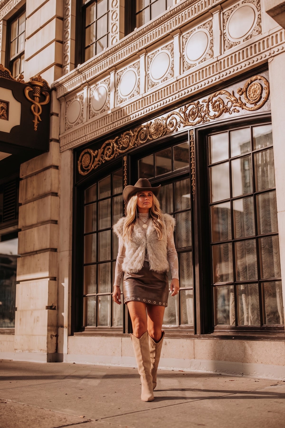 Extended sleeve faux fur vest. Perfect for NFR or anytime you need to dazzle