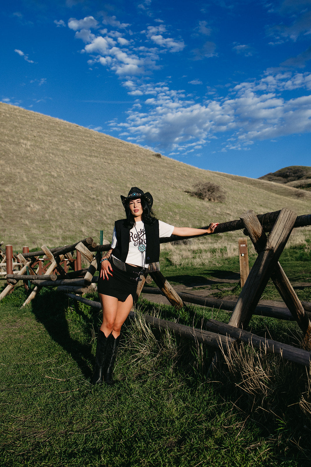 black mini skirt, edgy western style skirt for country concerts, fitted high waist summer skirt for western edgy outfits. Buckles on the skirt
