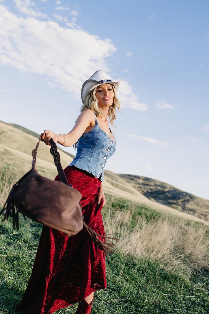 Brown suede fringe western shoulder bag for country concert outfits, gothic cowgirl fashion, rodeo style, western festival looks, boho cowgirl outfits, Nashville fashion, and edgy western boutique accessories from Sand + Charcoal Boutique.
