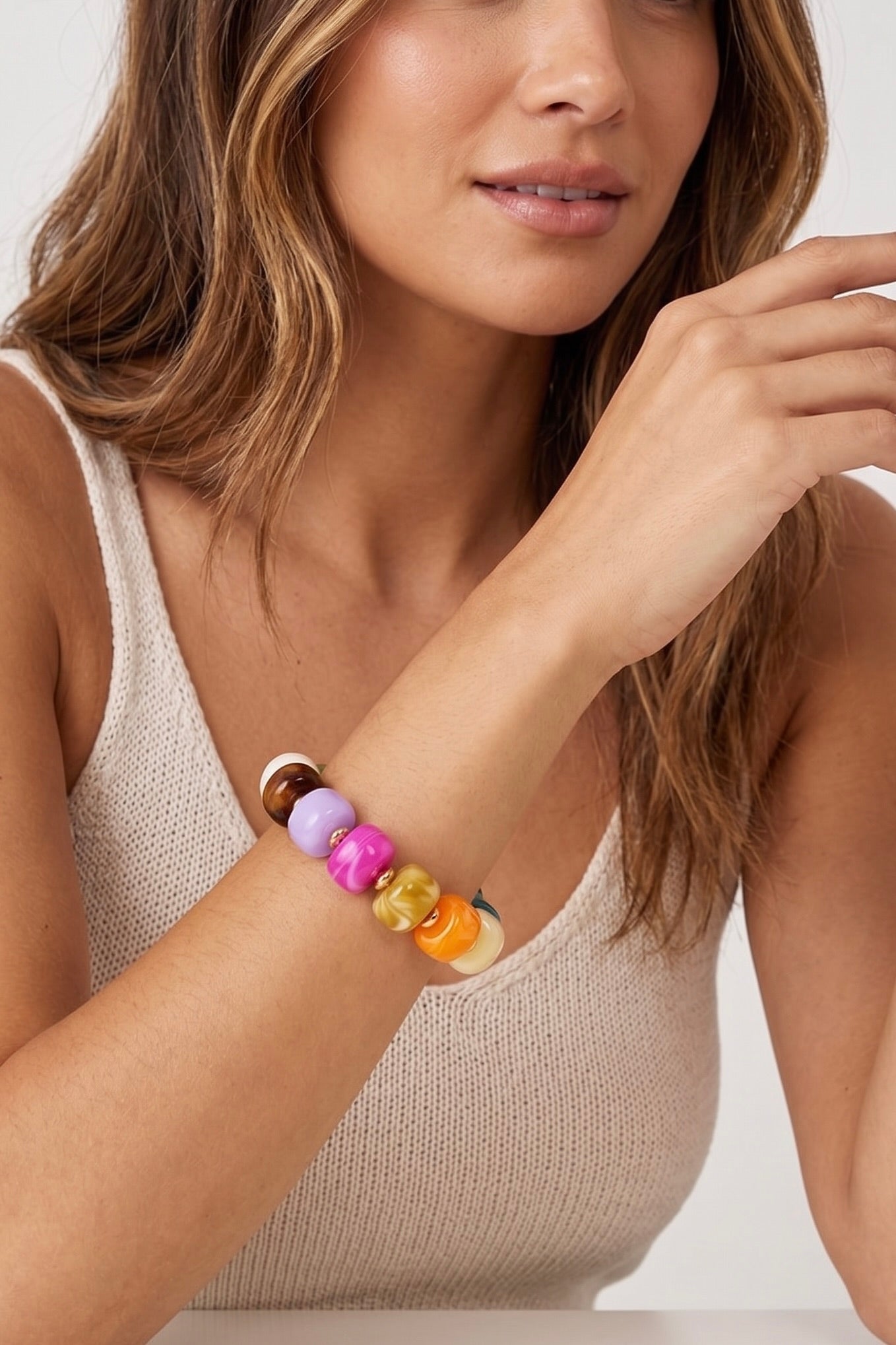 Colorful chunky glass bead stretch bracelet featuring vibrant multicolor beads with polished gold spacer accents for a fun, stackable boutique jewelry look.