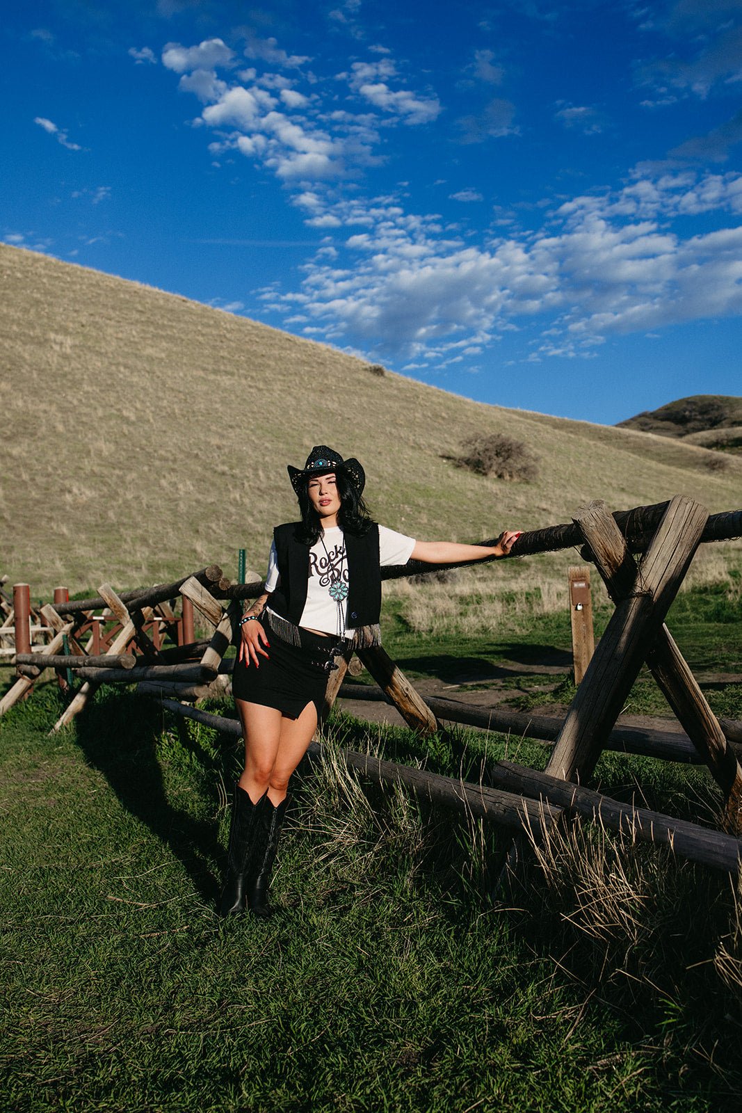 black mini skirt, edgy western style skirt for country concerts, fitted high waist summer skirt for western edgy outfits. Buckles on the skirt
