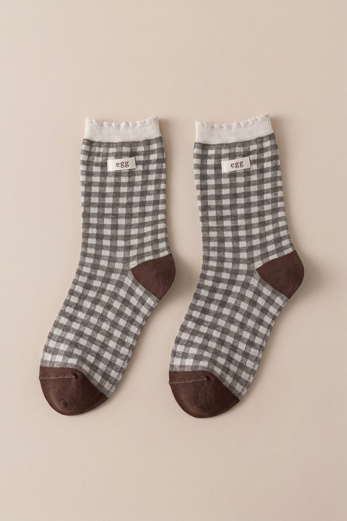 Women's blue gingham check crew socks with contrasting blue heel, toe and cuff details.