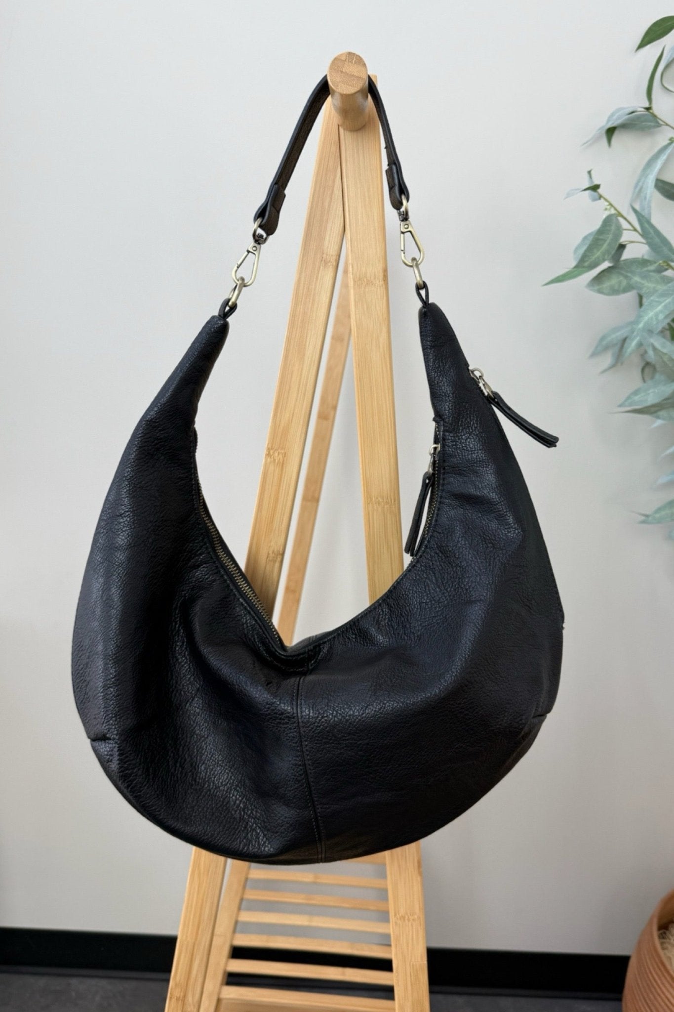 overstuffed crescent style vegan leather bag