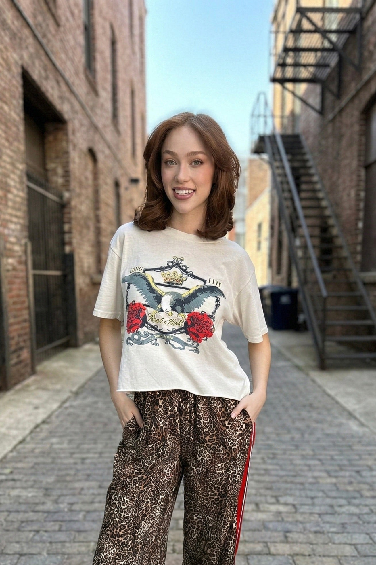 Women’s vintage eagle graphic crop tee with rose detail and relaxed fit cream t-shirt