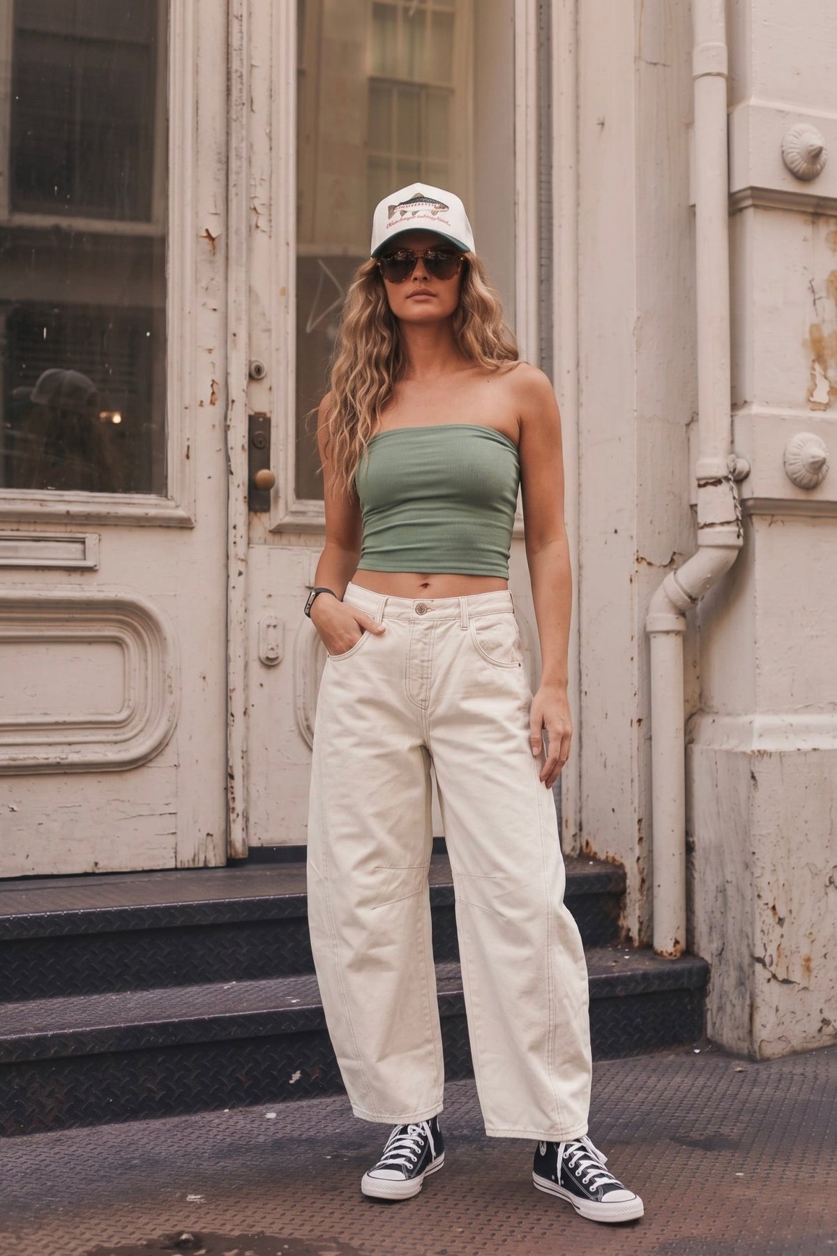 Free People Milk jeans in a creamy off-white wash featuring a high-rise waist, relaxed barrel-leg silhouette, curved wide legs, ankle-length hem, front and back pockets, belt loops, button and zip closure, and structured denim construction for an effortless everyday women’s jean.