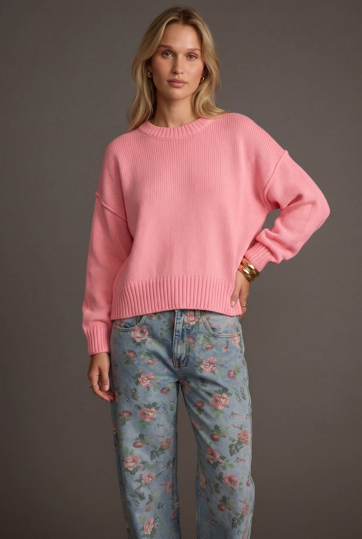 Women’s bubblegum pink knit sweater featuring a relaxed oversized fit, classic crew neckline, dropped shoulders, long sleeves, ribbed cuffs, and a wide ribbed hem with a slightly cropped silhouette for an easy everyday layering style.