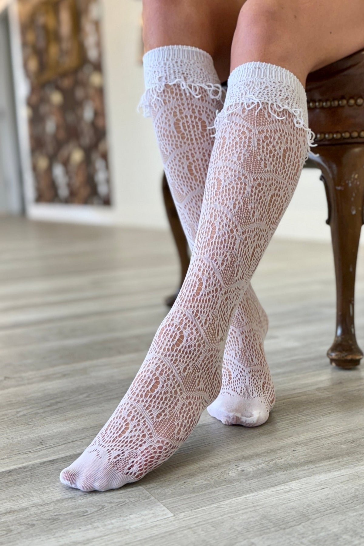 Knee high lace boot socks with fringe details. Perfect addition to your boot rotation.