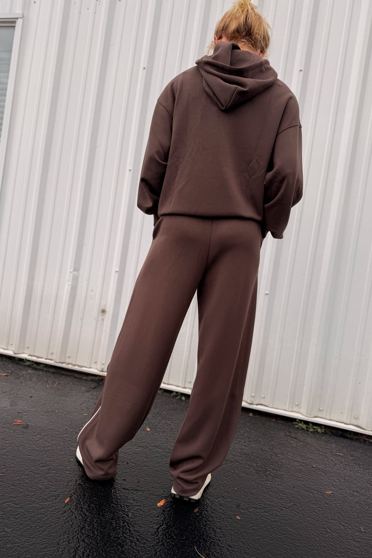 Women’s chocolate brown wide-leg sweatpants featuring a relaxed straight-leg silhouette, comfortable pull-on waistband, side pockets, and contrast ivory piping down the outer legs. Cozy lounge pants designed to coordinate with the matching chocolate brown hoodie, sold separately.