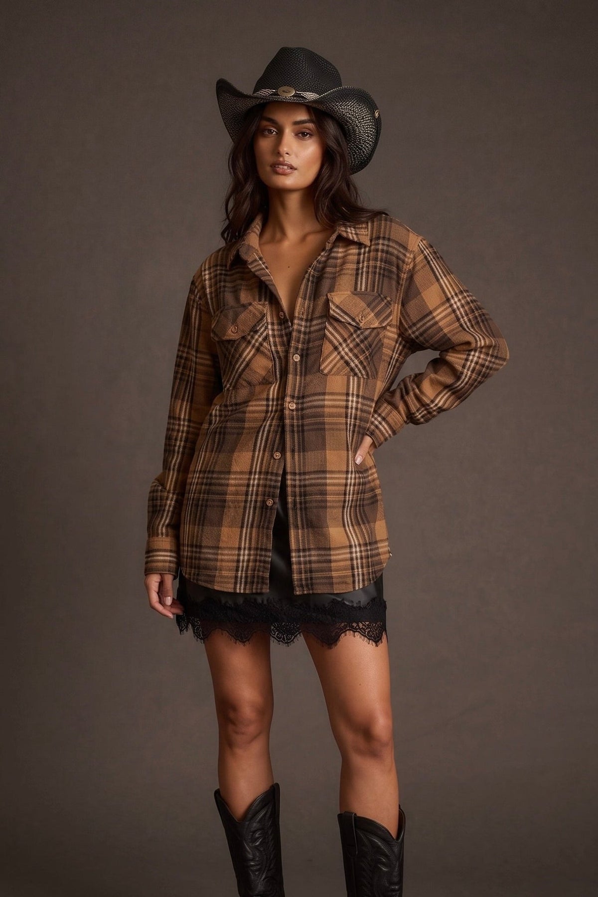 Women’s red, black and cream plaid flannel button-down shirt featuring a relaxed oversized fit, collared neckline, long sleeves, button front closure and dual chest flap pockets. Classic tartan plaid shirt styled as an easy layering piece for casual, grunge-inspired and fall outfits.