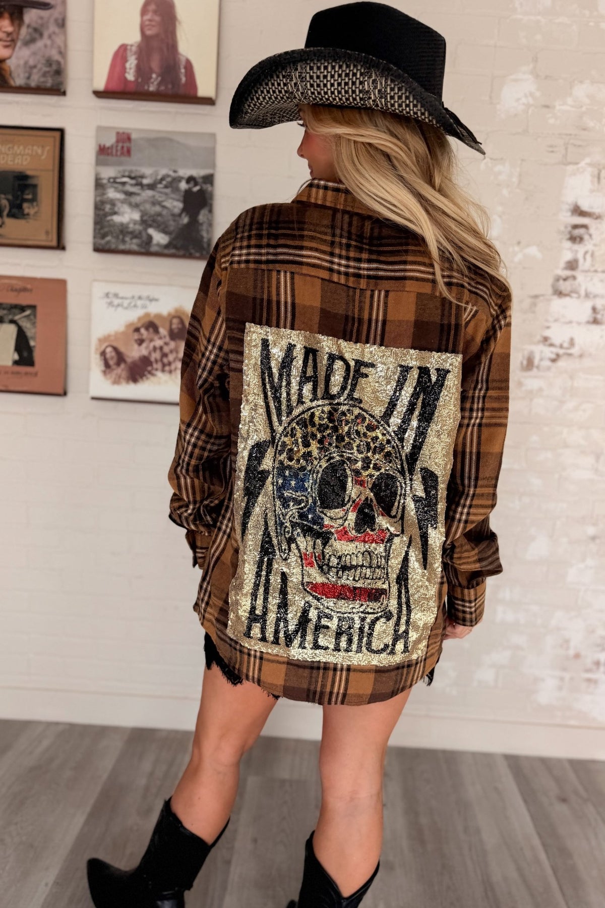 Women’s red, black and cream plaid flannel button-down shirt featuring a relaxed oversized fit, collared neckline, long sleeves, button front closure and dual chest flap pockets. Classic tartan plaid shirt styled as an easy layering piece for casual, grunge-inspired and fall outfits.
