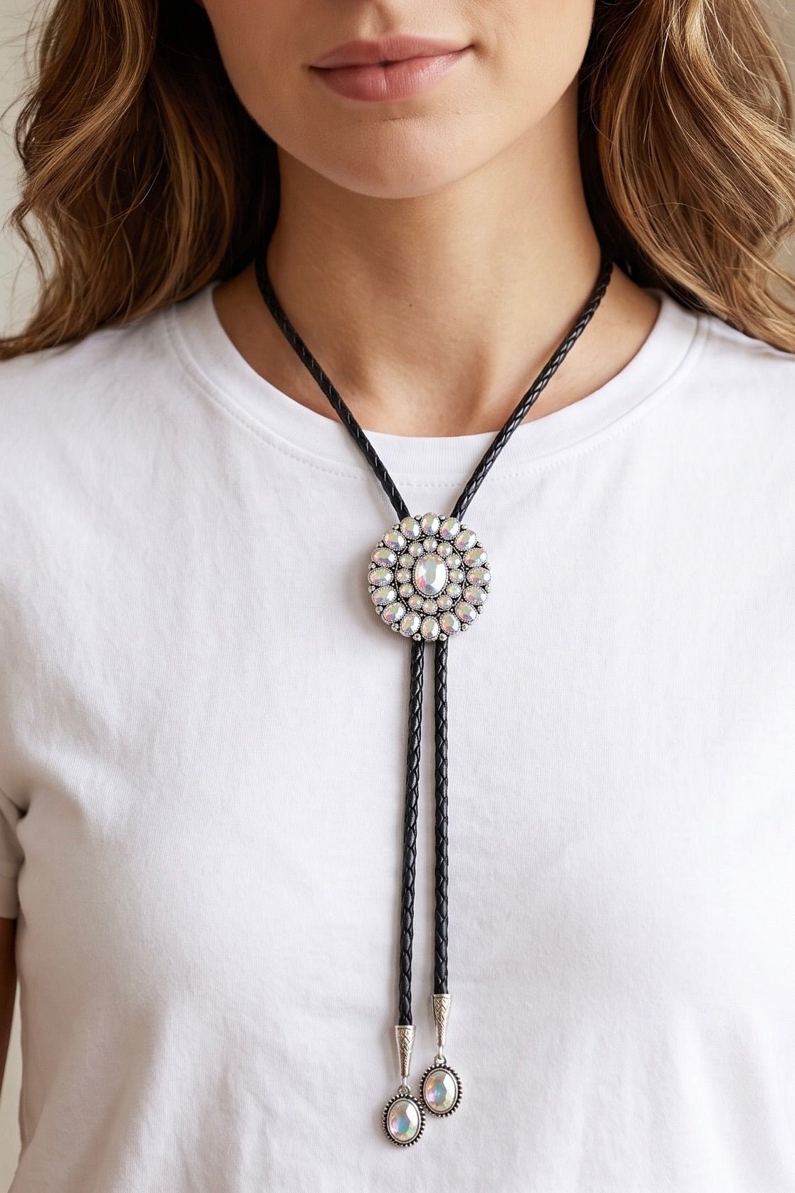 Western bolo tie necklace with black braided cord, round crystal concho and coordinating crystal drop tips.