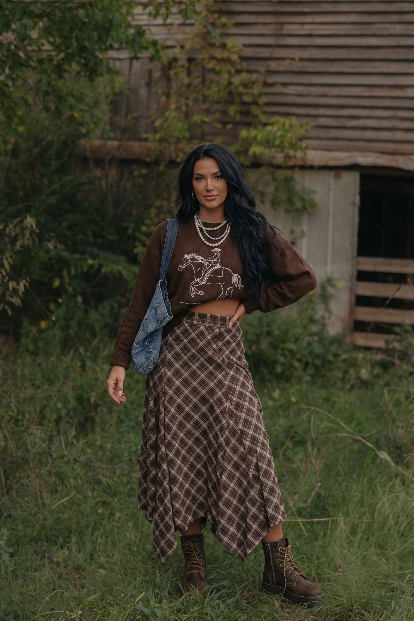 Brown plaid midi skirt with a flowy A-line silhouette, asymmetrical handkerchief hem and elastic back waistband.