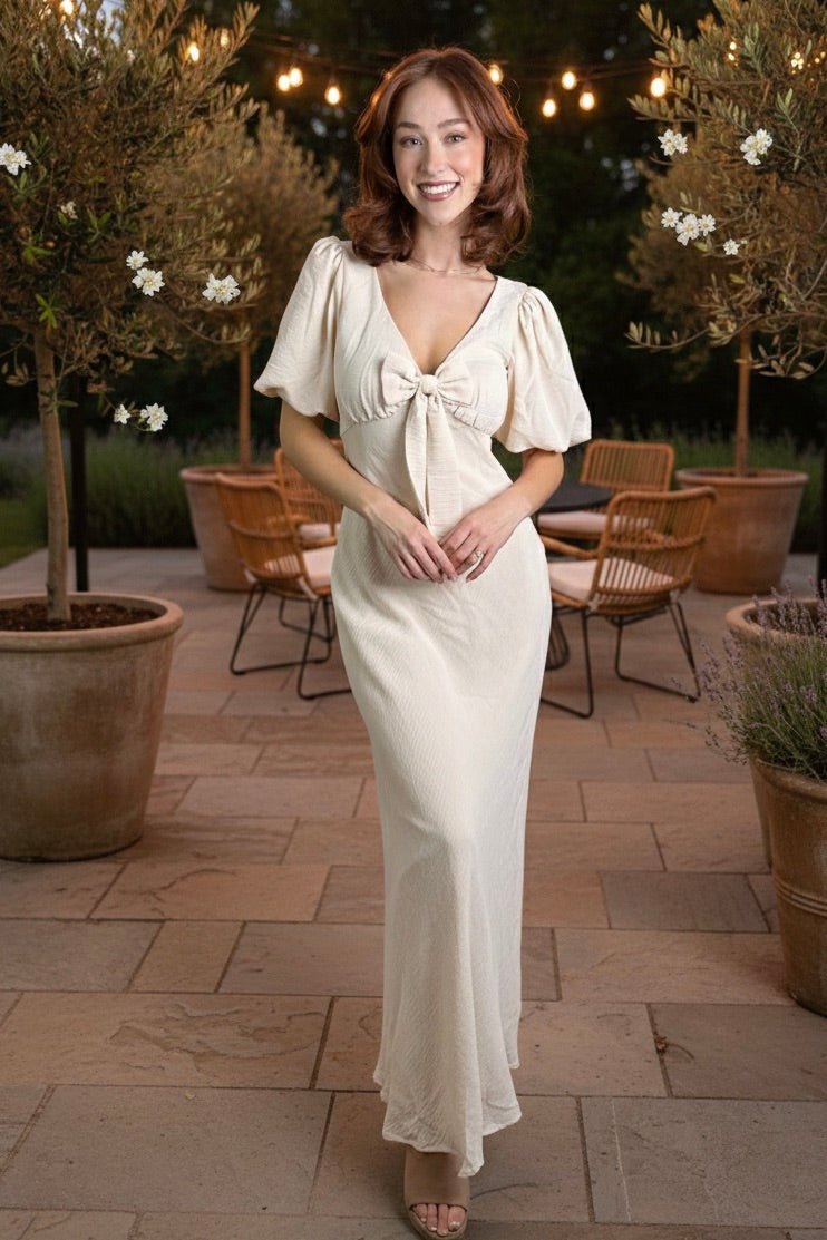 porcelain maxi dress, puff sleeve maxi, bow front dress, wedding guest dress, romantic spring dress, cream maxi dress, v-neck maxi dress, feminine brunch outfit, elegant garden party dress.