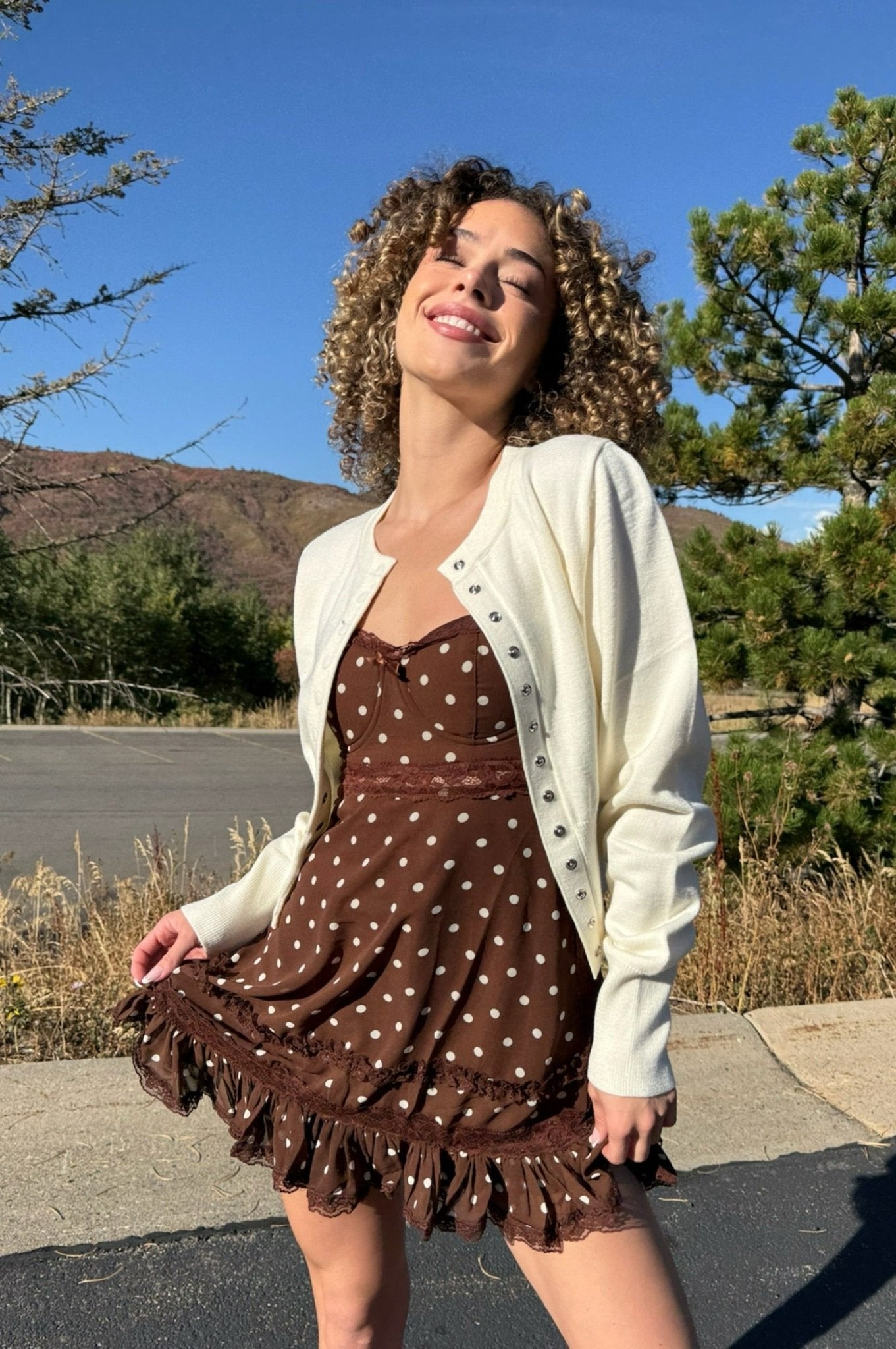 Ivory cardigan with snap closures.  High quality