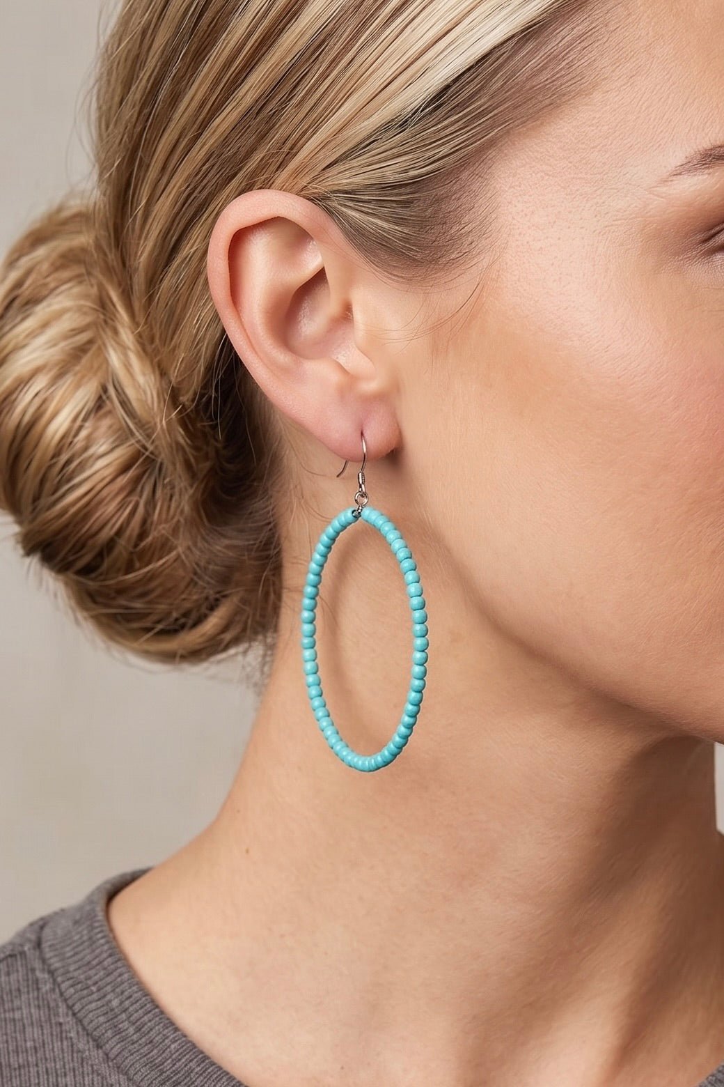 Handmade turquoise beaded hoop earrings featuring 65mm hoops, vibrant synthetic turquoise beads, and fish hook closures.