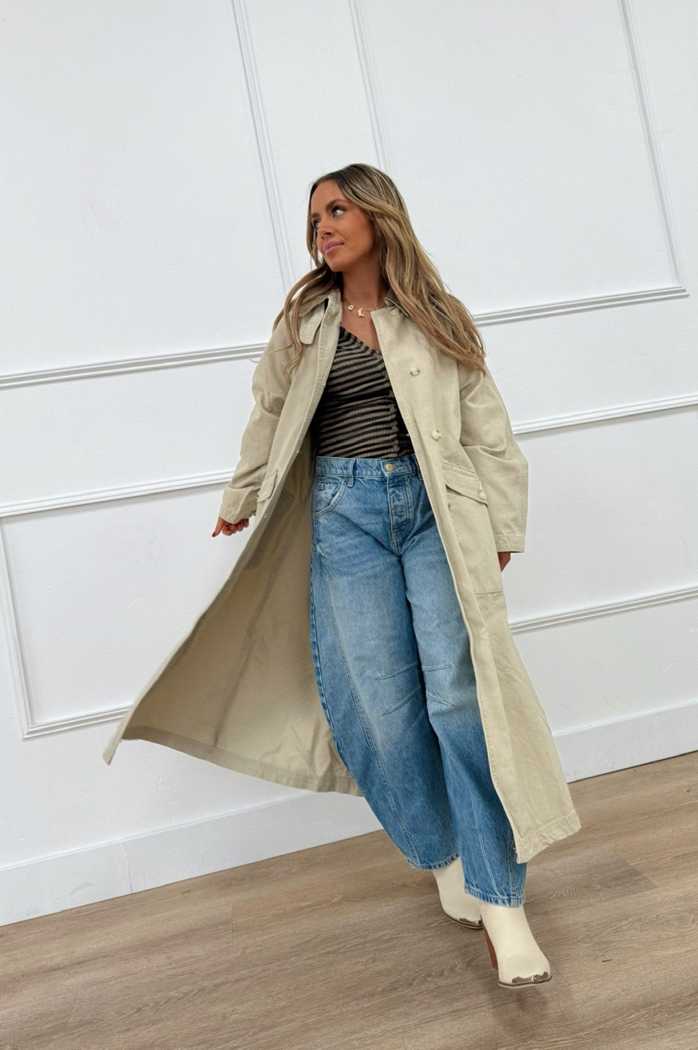 Oversized neutral trench coat with long length, button front, and back storm flap.